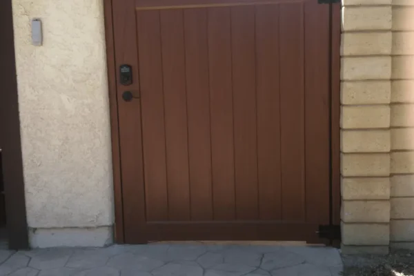 Brown Vinyl Gate With A Black Smart Lock And Handle