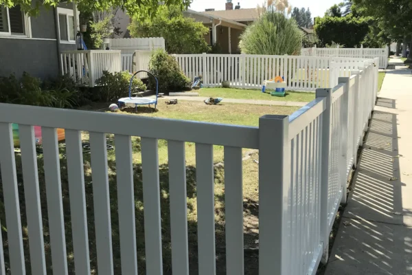 White Perimeter Vinyl Fence With A Vinyl Gate In Los Angeles
